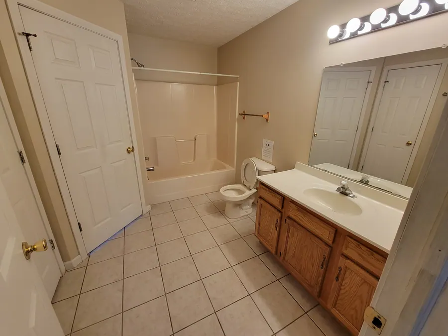 Premier bathroom with a wide vanity and bathtub